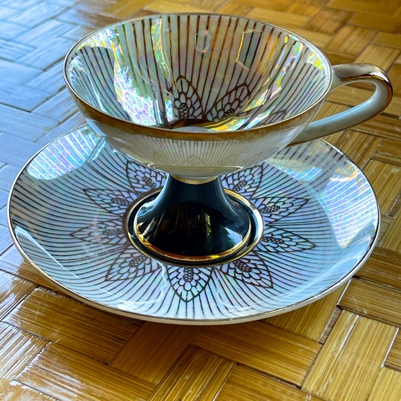 Black & white iridescent tea cup & saucer w/gilt